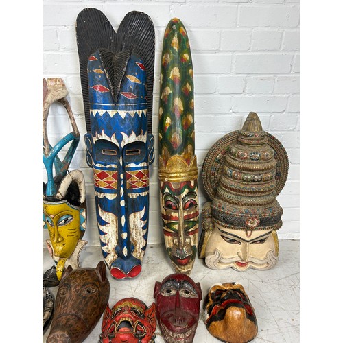 196 - A COLLECTION OF TWENTY TWO AFRICAN TRIBAL MASKS, 

Largest measures 98cm x 26cm