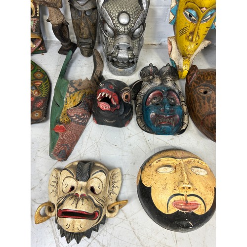 196 - A COLLECTION OF TWENTY TWO AFRICAN TRIBAL MASKS, 

Largest measures 98cm x 26cm