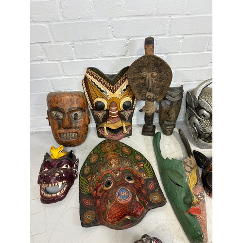 196 - A COLLECTION OF TWENTY TWO AFRICAN TRIBAL MASKS, 

Largest measures 98cm x 26cm