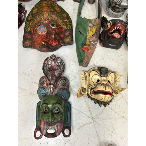 196 - A COLLECTION OF TWENTY TWO AFRICAN TRIBAL MASKS, 

Largest measures 98cm x 26cm