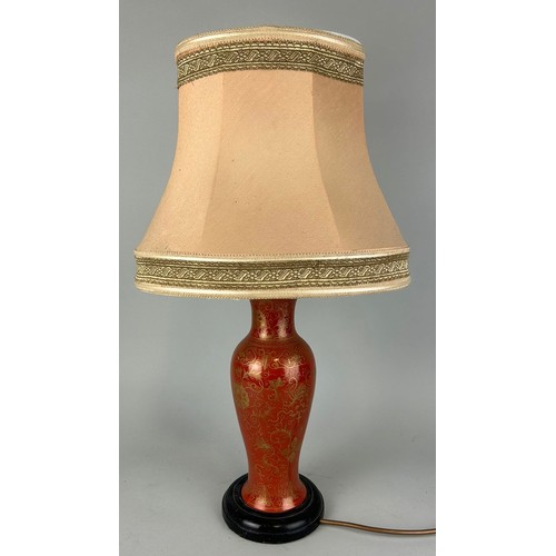 84 - AN EARLY 20TH CENTURY RED AND GILT CHINESE VASE ADAPTED FOR A LAMP, 

39cm H

With shade 63cm.