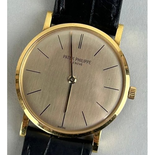 156 - AN 18CT GOLD GENTLEMAN'S PATEK PHILIPPE WRISTWATCH WITH BLACK PATEK STRAP, 

With case. 

Dial 29mm ... 