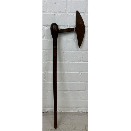 195 - A TRIBAL AXE, 

74cm L