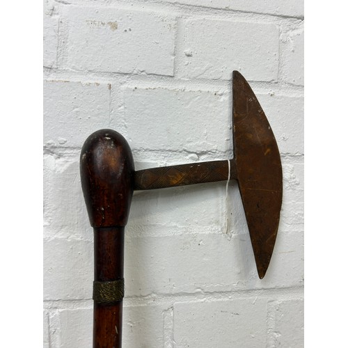 195 - A TRIBAL AXE, 

74cm L