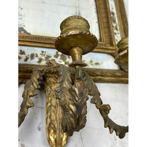 498 - A 19TH CENTURY REGENCY DESIGN WALL MIRROR WITH THREE CANDELABRA,

84cm x 40cm

For restoration.