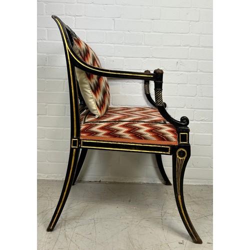 3 - A REGENCY PERIOD EMPIRE ARMCHAIR,

With lyriform splat, gilt top rail, arms and legs, patterned upho... 