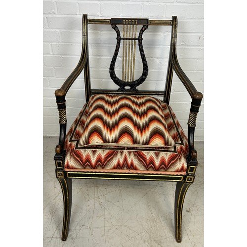 3 - A REGENCY PERIOD EMPIRE ARMCHAIR,

With lyriform splat, gilt top rail, arms and legs, patterned upho... 