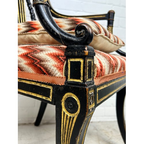 3 - A REGENCY PERIOD EMPIRE ARMCHAIR,

With lyriform splat, gilt top rail, arms and legs, patterned upho... 