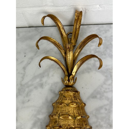 500 - A PAIR OF HOLLYWOOD REGENCY GILT PAINTED PINEAPPLE CANDLEABRA, 

52cm x 26cm each.