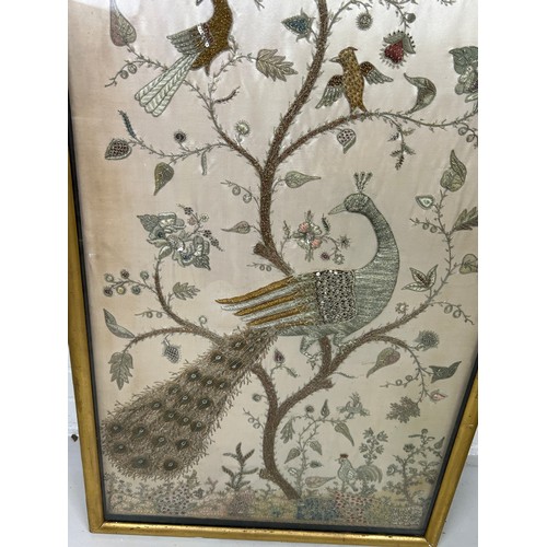 309 - A CHINESE WIRE WORK PICTURE DEPICTING BIRDS AMONGST FOLIAGE, 

112cm x 52cm

Mounted in a frame and ... 