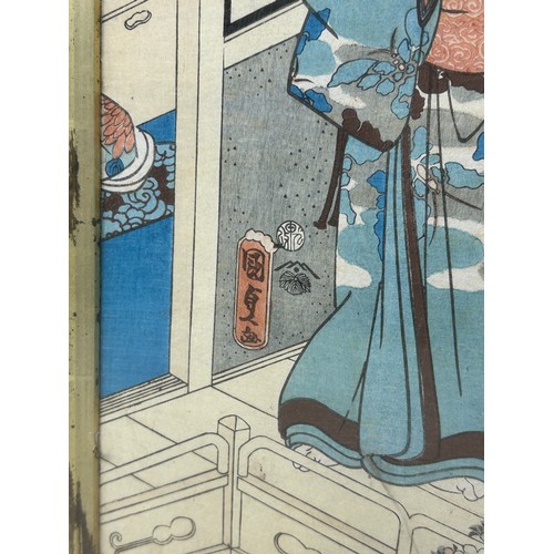 268 - A JAPANESE WOODBLOCK DEPICTING TWO FIGURES, 

38cm x 24cm 

Mounted in a frame and glazed. 

45cm x ... 