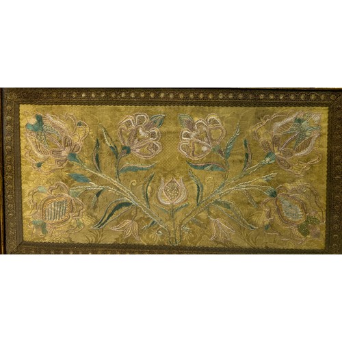 265 - AN 18TH OR 19TH CENTURY SILK EMBROIDERY OF FLOWERS, 

Mounted in a frame and glazed. 

53cm x 29cm