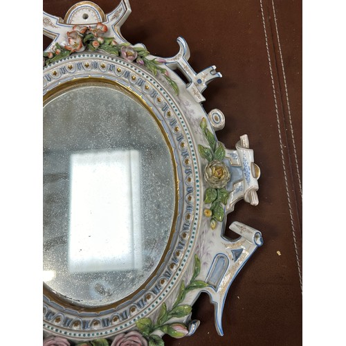 39 - A SMALL DRESDEN PORCELAIN MIRROR AFTER MEISSEN, 

34cm x 27cm