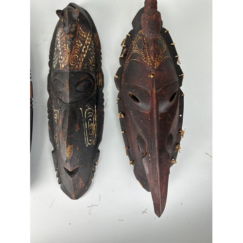 199 - A GROUP OF THREE OCEANIC PAINTED WOODEN MASKS, 

Largest 48cm L