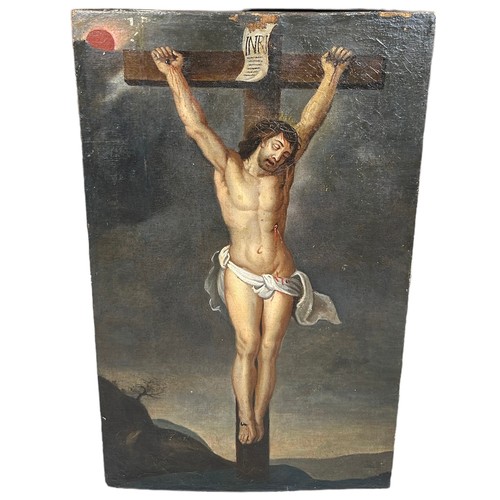 271 - A 19TH CENTURY OIL PAINTING ON CANVAS LAID ON BOARD DEPICTING CHRIST ON THE CROSS, 

79cm x 47cm