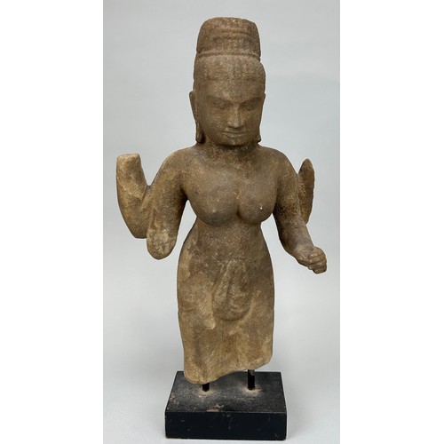 261 - A CAMBODIAN STONE FIGURE OF A DEITY, 

46cm x 26cm 

On wooden base with metal prongs. 

53cm H