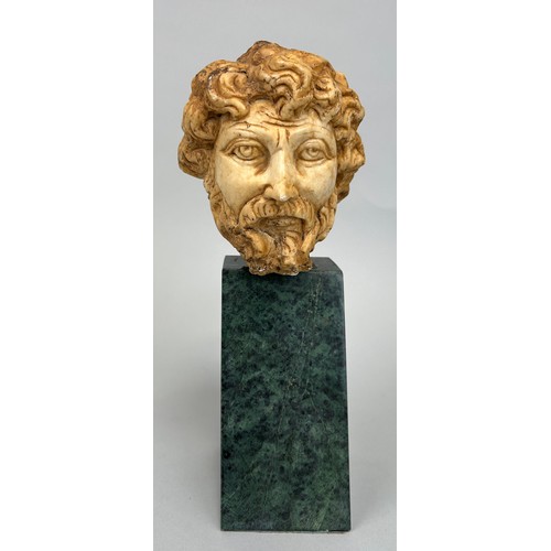 260 - A ROMAN STYLE BUST OF AN EMPEROR ON GREEN MARBLE STAND, 

Bust 14cm x 11cm 

Mounted (loosely) on gr... 