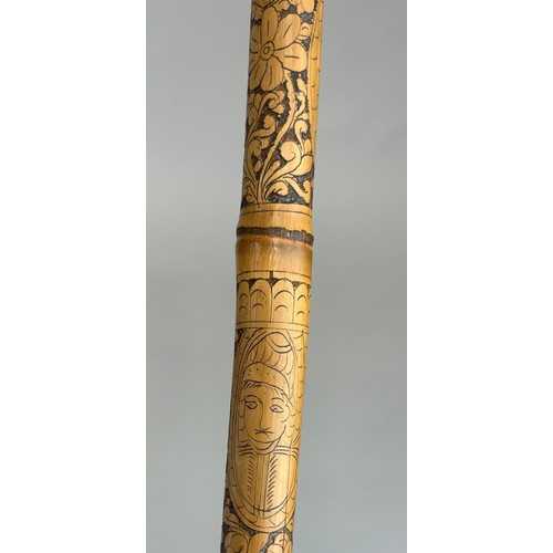 188 - A HIGHLY UNUSUAL CARVED BAMBOO WALKING STICK OR CANE CARVE WITH EXOTIC BIRDS, FIGURES AND FOLIAGE, 
... 