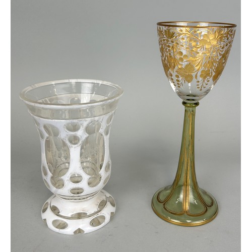 182 - TWO CONTINENTAL GLASSES, 

One Germanic white enamel overlaid, the other gilt painted with gilt stem... 