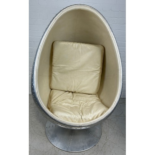 468A - IN THE MANNER OF EERO AARNIO: A SWIVEL AVIATOR EGG CHAIR, 

Chromed metal with beige leather interio... 