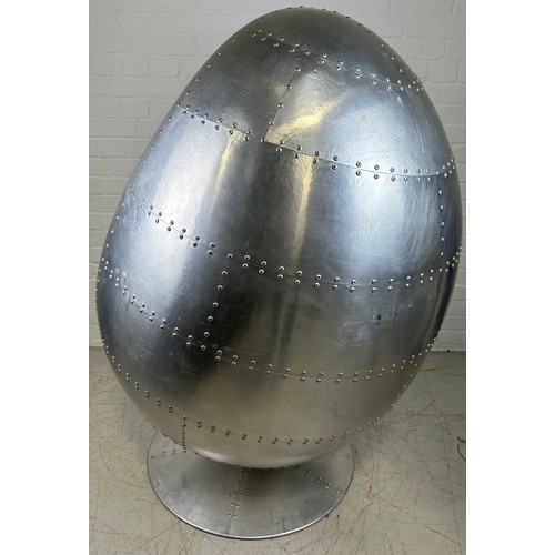 468A - IN THE MANNER OF EERO AARNIO: A SWIVEL AVIATOR EGG CHAIR, 

Chromed metal with beige leather interio... 