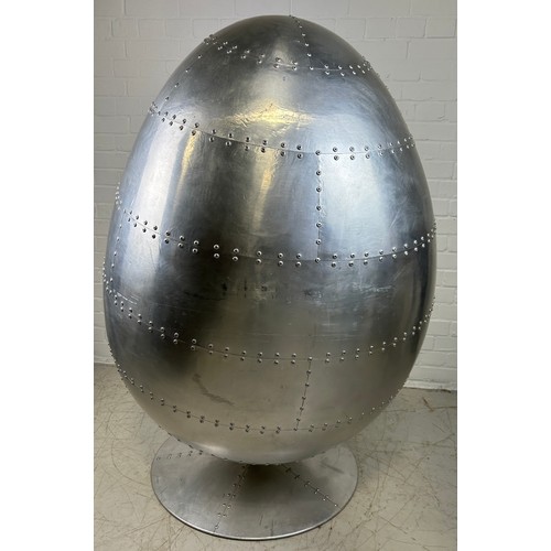 468A - IN THE MANNER OF EERO AARNIO: A SWIVEL AVIATOR EGG CHAIR, 

Chromed metal with beige leather interio... 