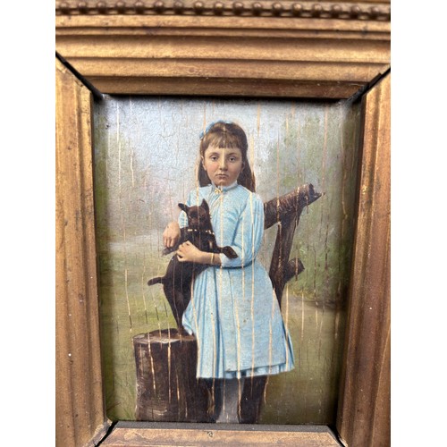 18 - DOG INTEREST: AN OIL PAINTING POSSIBLY OVER A PHOTOGRAPH ON BOARD DEPICTING A GIRL IN A BLUE DRESS H... 