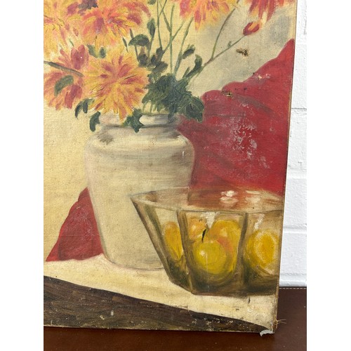 20 - AN OIL PAINTING ON CANVAS DEPICTING A STILL LIFE OF FLOWERS IN A VASE WITH A BOWL AND LEMONS, 

51cm... 