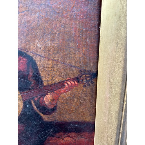 21 - A 19TH CENTURY OIL PAINTING ON CANVAS DEPICTING A LADY IN A RED DRESS PLAYING A BANJO, 

Signed indi... 