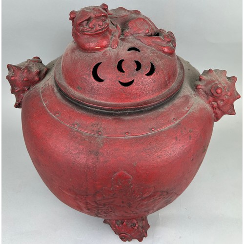 197A - A VERY LARGE CHINESE RED METAL INCENSE BURNER WITH FOO DOG LID, SHELL HANDLES AND FEET, 

Figure of ... 