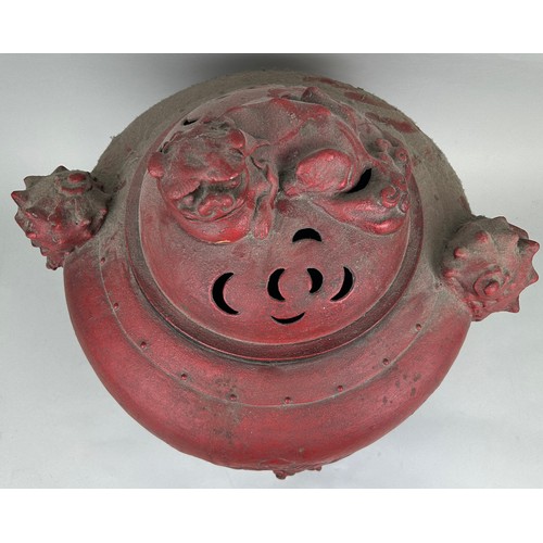 197A - A VERY LARGE CHINESE RED METAL INCENSE BURNER WITH FOO DOG LID, SHELL HANDLES AND FEET, 

Figure of ... 