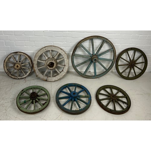 68 - A GROUP OF SEVEN ANTIQUE PAINTED CARTWHEELS, 

Largest 60cm D