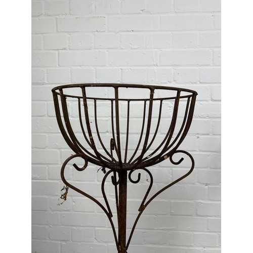 85 - A PAIR OF ANTIQUE WROUGHT IRON JARDINIERE STANDS ON TRIPOD SCROLL BASES, 

76cm x 42cm