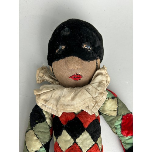 42 - A GROUP OF SIX ANTIQUE DOLLS TO INCLUDE A HARLEQUIN JESTER (6)

Largest 56cm L
