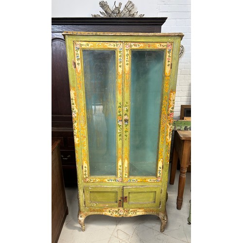 89 - AN ITALIAN FLORENTINE PAINTED CABINET WITH GLAZED DOORS AND SIDES ON FOUR CABRIOLE LEGS

167cm x 90c... 