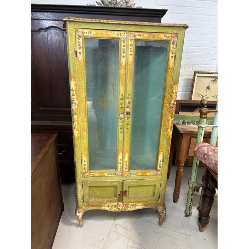 89 - AN ITALIAN FLORENTINE PAINTED CABINET WITH GLAZED DOORS AND SIDES ON FOUR CABRIOLE LEGS

167cm x 90c... 
