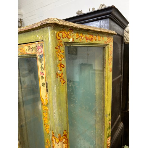 89 - AN ITALIAN FLORENTINE PAINTED CABINET WITH GLAZED DOORS AND SIDES ON FOUR CABRIOLE LEGS

167cm x 90c... 