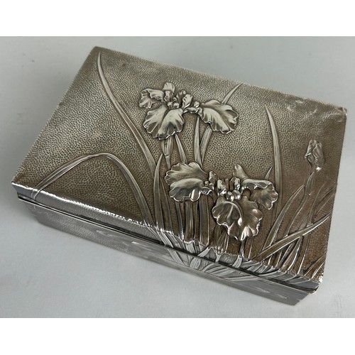 145 - AN ORIENTAL SILVER BOX DECORATED WITH FLOWERS, 

Inscribed inside 'Rokkosan 1914 Tombstone won by Mr... 