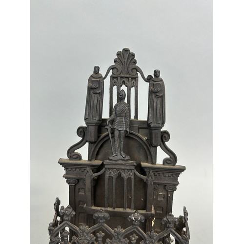 132 - A 19TH CENTURY CAST IRON LETTER RACK ALONG WITH A SIMILAR ECCLESIASTICAL BRONZE, 

25cm x 14cm 

23c... 