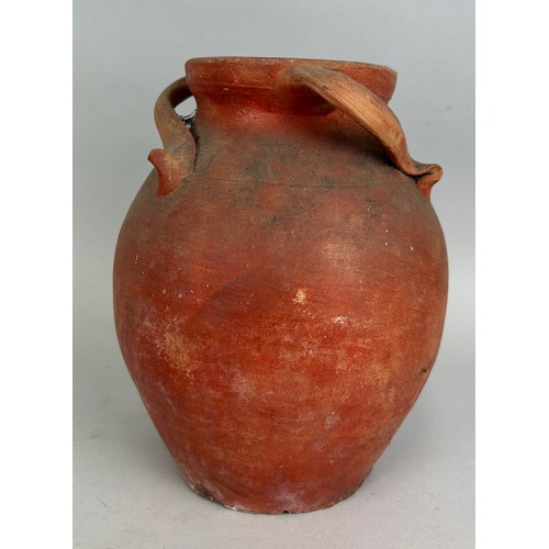 47 - A TERRACOTTA POT WITH UNUSUAL TWISTED HANDLES, 

24cm H