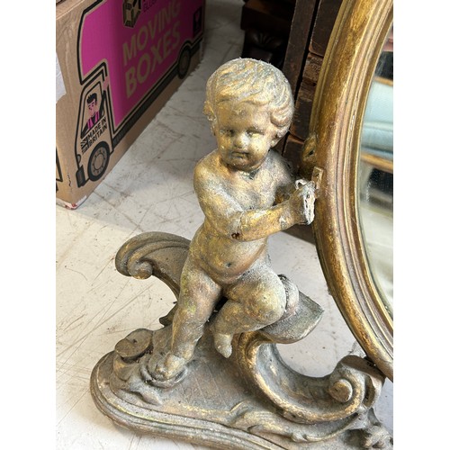 101 - A FRENCH GILDED WALL MIRROR FLANKED BY PUTTI, 

90cm x 80cm