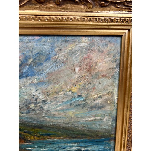 161 - AN OIL PAINTING ON CANVAS DEPICTING A COASTAL SCENE WITH CLIFFS, SEA AND SUNLIGHT BREAKING THROUGH T... 