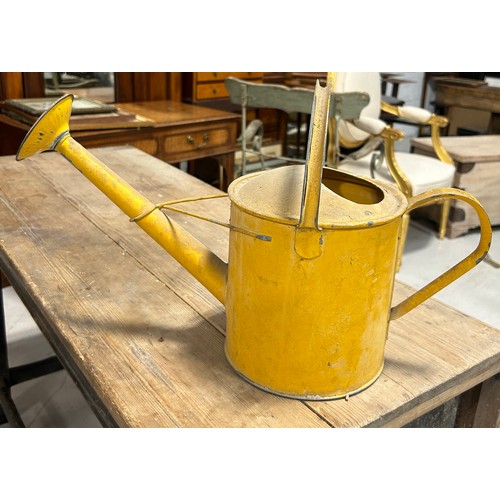 84B - AN ANTIQUE YELLOW WATERING CAN,

50cm x 30cm