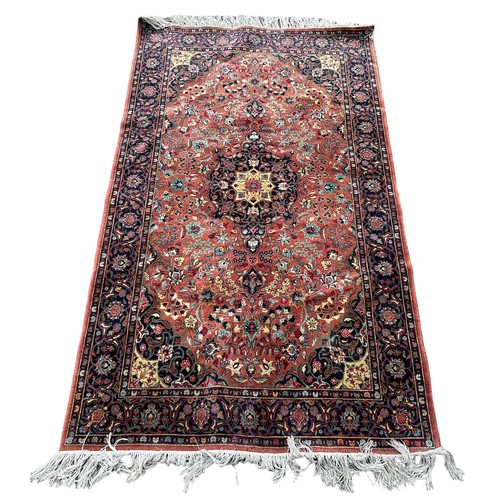 890 - A PERSIAN DESIGN CARPET, 

190cm x 113cm