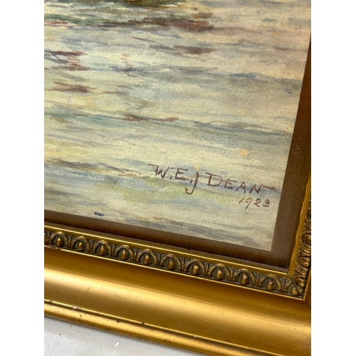 110 - A WATERCOLOUR PAINTING ON PAPER DEPICTING SHIPS IN A HARBOUR SIGNED 'W.E.J. DEAN', 

47cm x 34cm 

M... 