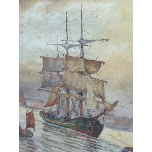 110 - A WATERCOLOUR PAINTING ON PAPER DEPICTING SHIPS IN A HARBOUR SIGNED 'W.E.J. DEAN', 

47cm x 34cm 

M... 