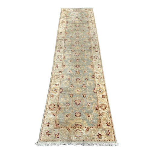 892 - A PERSIAN DESIGN RUNNER,

290cm x 80cm