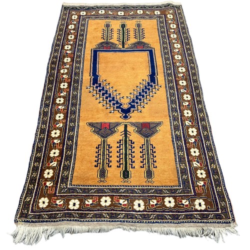 894 - A PERSIAN DESIGN CARPET, 

205cm x 115cm