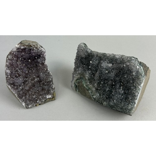 148 - AN AMETHYST PAIR,

Largest 11cm x 7cmn 

A pair of amethyst clusters, on cut stands for display. 
Br... 