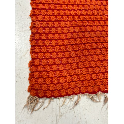 895 - AN ORANGE AND RED WEAVE WELSH BLANKET BLANKET, 

200cm x 130cm